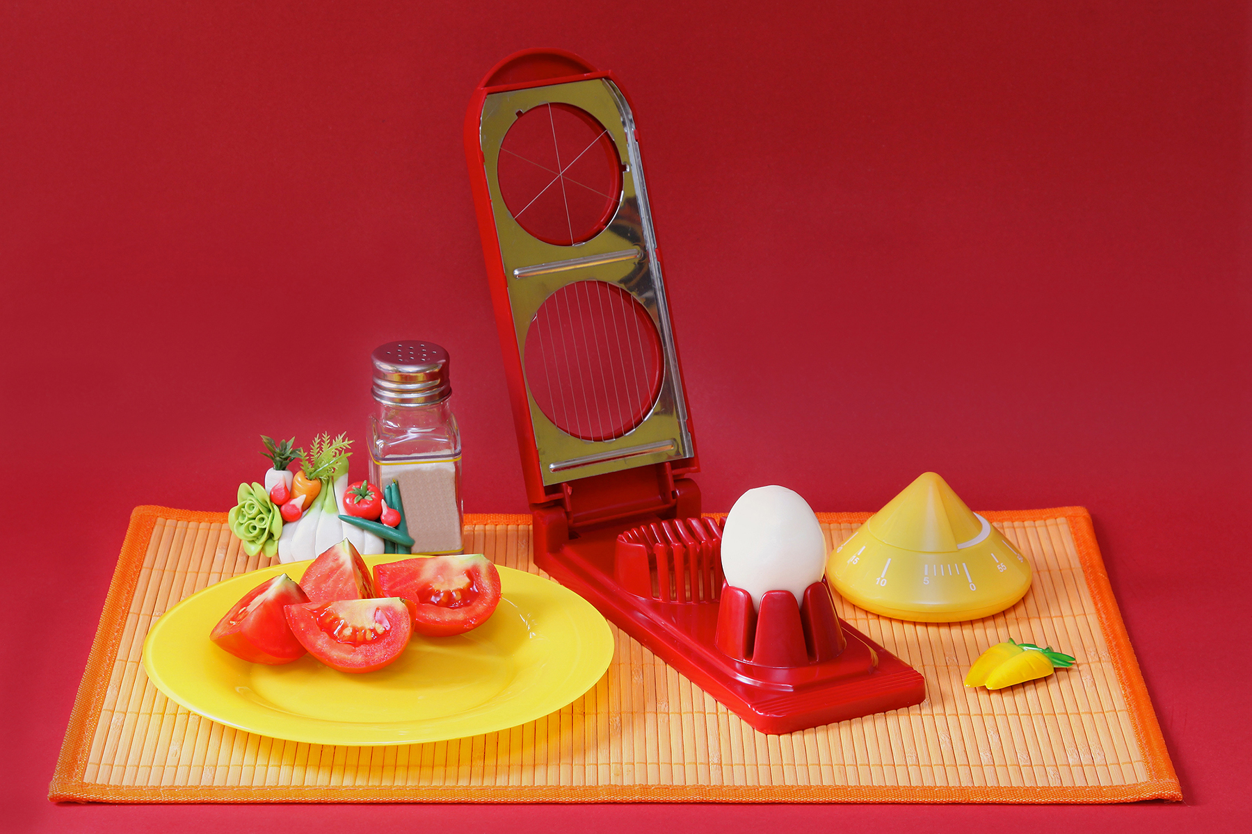 Breakfast served on rattan table mat with boiled egg cutter