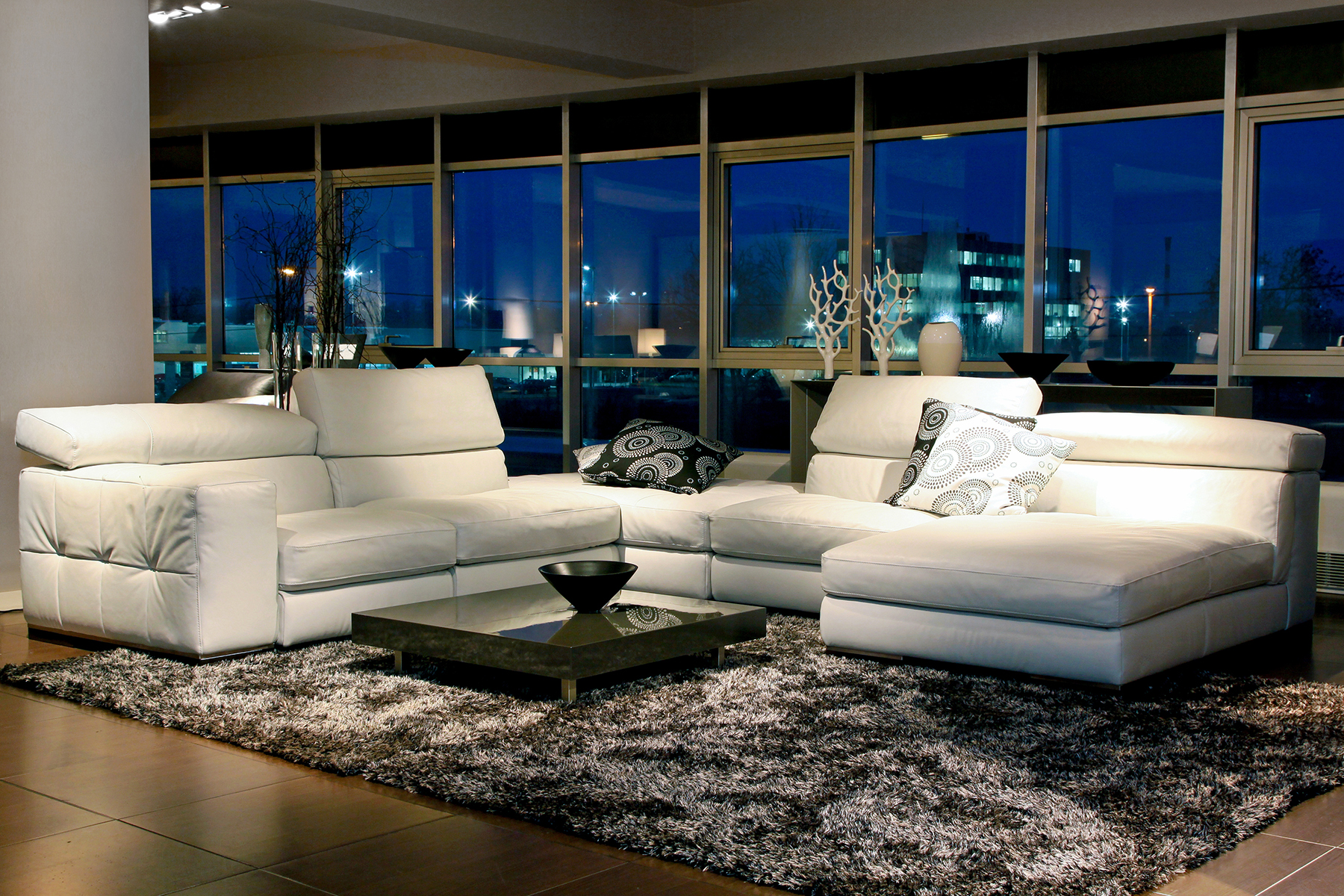 Spacious living room with beautiful view through glass wall